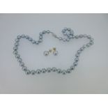A matched suite of dove grey cultured pearl earstuds and necklace,