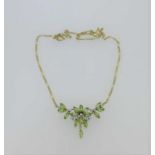 A peridot and diamond necklace,