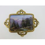 A mid 19th century enamelled plaque brooch depicting an Alpine scene,