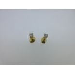 A pair of single stone diamond earstuds,
