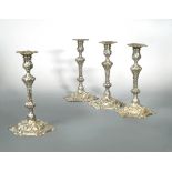 A set of 4 George III cast silver candlesticks,