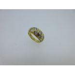 An 18ct gold and diamond set chequerboard bombé ring,