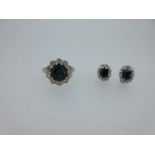 A sapphire and diamond cluster ring together with a pair of similarly set earstuds,