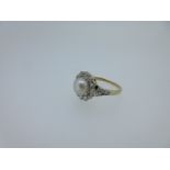 A cultured pearl and diamond cluster ring,