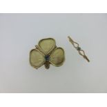 A 9ct gold trefoil brooch / pendant set with a sapphire and a small brooch set with a blue zircon,
