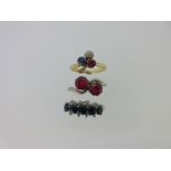 A red, white and blue trio of ruby, sapphire and diamond rings,