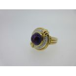 A modern amethyst and diamond ring,