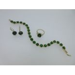 A diopside and diamond ring with matched earpendants and line bracelet,