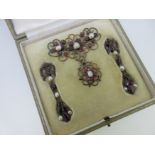 A Georgian garnet and pearl stomacher and matched earpendants cased by Tessier,