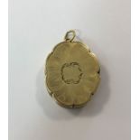 A Victorian silver gilt vinaigrette pendant by Nathaniel Mills,