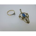 An Edwardian black opal and diamond pendant and a diamond ring,