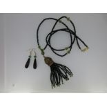 An onyx tassel necklace and earring suite,