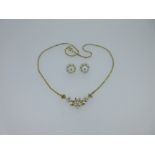 A gold and cultured pearl necklace with a pair of cultured pearl adaptable cluster earstuds,
