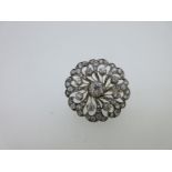 A Victorian circular diamond brooch / pendant,