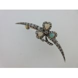An antique diamond crescent and opal shamrock brooch,