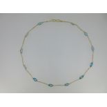 A blue topaz and chain necklace,