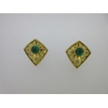 A pair of emerald and diamond earclips,