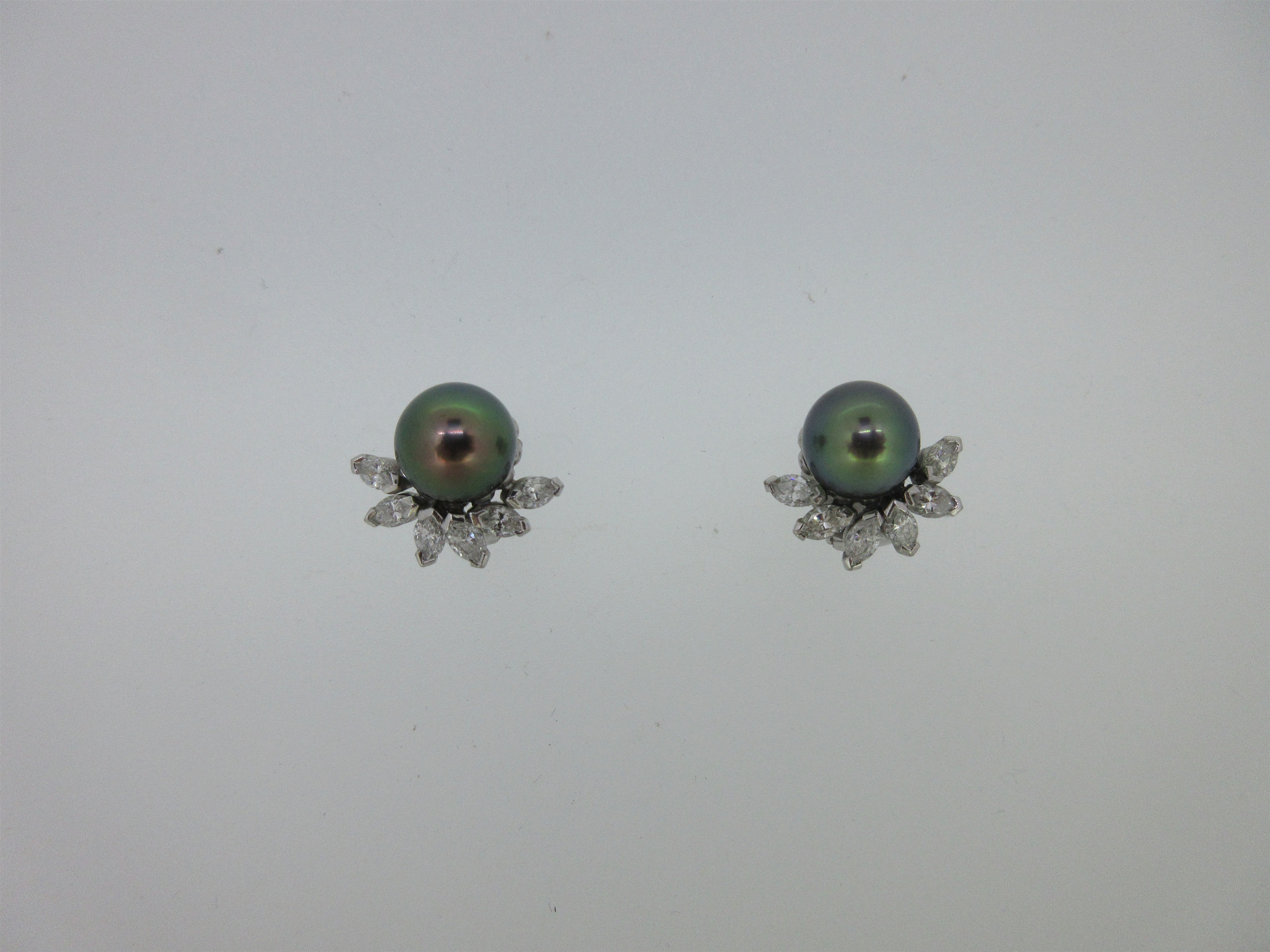 A pair of Tahitian pearl and diamond earclips,