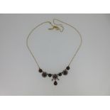 A garnet, seed pearl and diamond necklace,