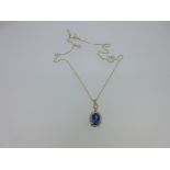 A tanzanite, diamond and 18ct gold pendant and chain,