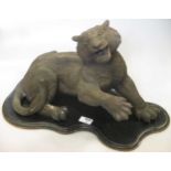 A cast resin bronzed study of a wild cat on base 32 cm high (not including base)