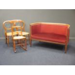 A 19th century inlaid settee, 127cm wide; together with a pair of balloon back chairs and a single