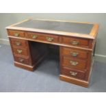 An Edwardian mahogany twin pedestal desk, 137cm wide