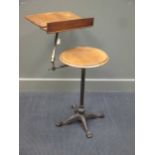 A Victorian adjustable reading table on a cast iron base by Carters