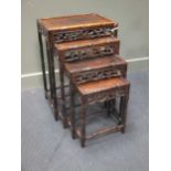 A nest of four Chinese hardwood occasional tables with drawers