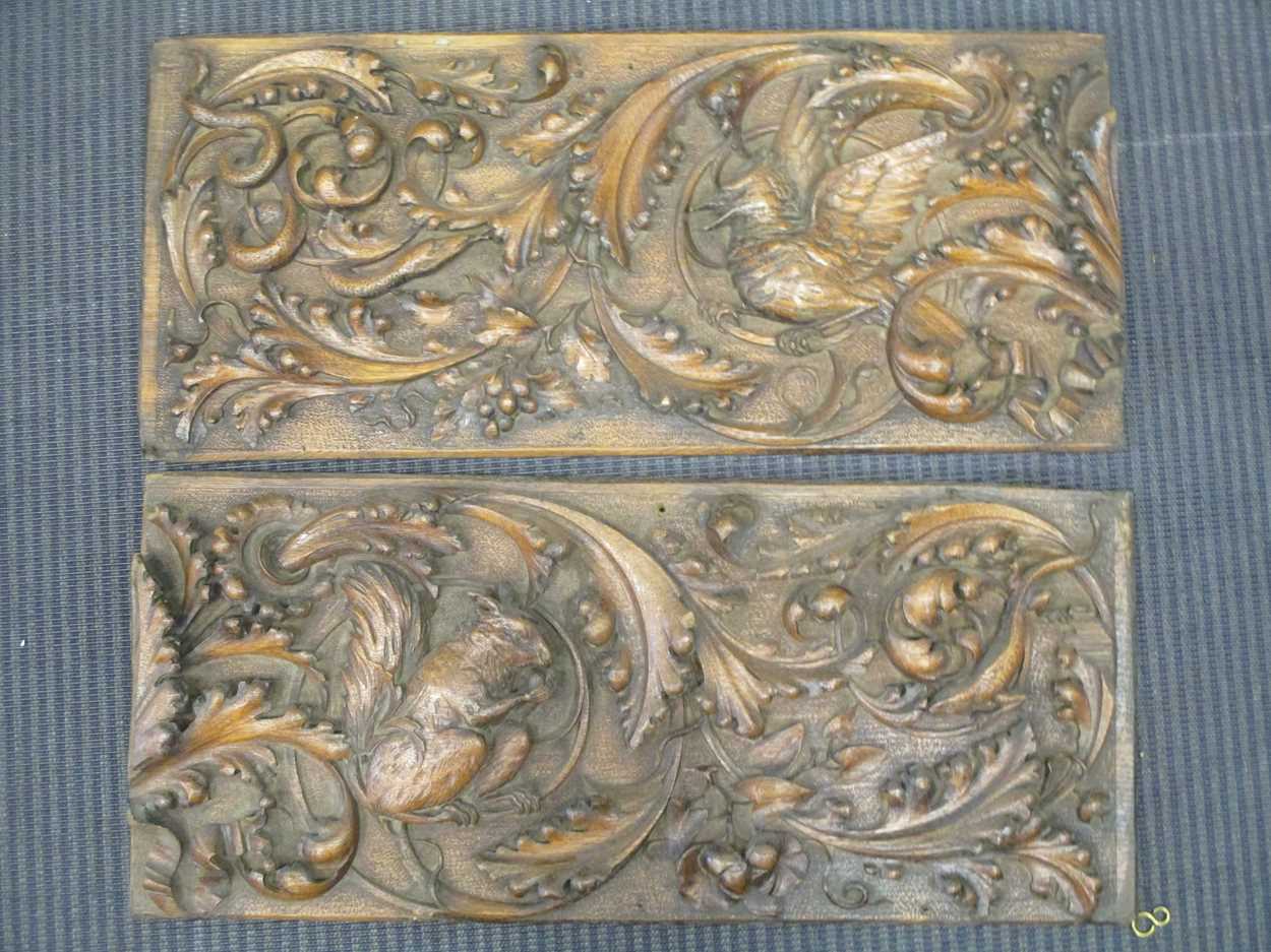 A pair of carved oak panels