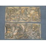 A pair of carved oak panels