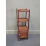 A three tier whatnot, with moulded frame and cupboard door to the base, early 20th century, 111.