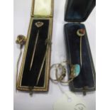 Three 19th century stick pins, together with a ruby and pearl ring and an amazonite ring (6)