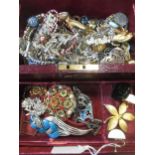 Two jewellery boxes containing a quantity of costume jewellery, including a pendant by Miracle, a