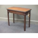 A George III mahogany rectangular fold over top table in the Chippendale manner