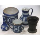 An usual Adams blue jasperware jardinière, sprigged with the religious monogram 'IHS', 18cm high;