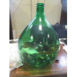 Four green glass brewing bottles, 64cm high (4)