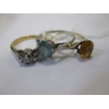 A single stone diamond ring together with a citrine ring and a blue zircon ring (3)