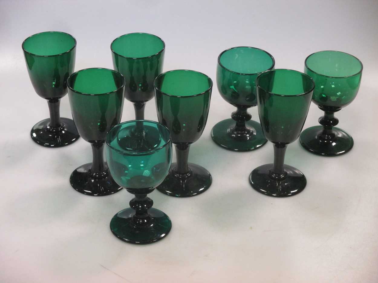 Eight green coloured glasses