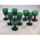 Eight green coloured glasses