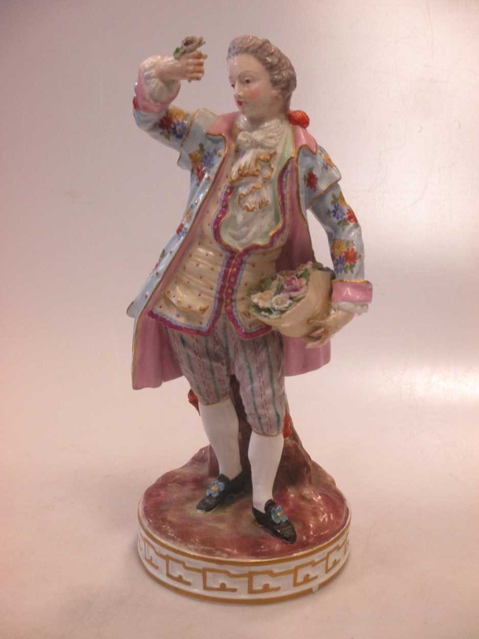 A 19th century Meissen figure of a gentleman,