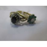 An emerald and diamond cluster ring together with a sapphire and diamond cluster ring (2)