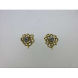 A pair of 9ct gold and diamond screw back earrings,