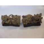 A pair of Chinese carved giltwood dragons