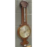 An early 20th century oak aneroid barometer 81cm high