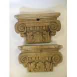 A pair of oak capitals 16cm high