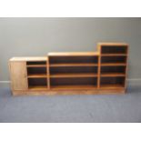 An Art Deco walnut stepped bookcase together with an Art Deco walnut leather inset writing desk (2)