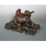 A Chinese hard wood carving of a Boy riding a buffalo group, 20th century