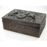 A Chinese/Far Eastern relief carved hardwood box