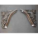 A pair of oak brackets of trumpeters